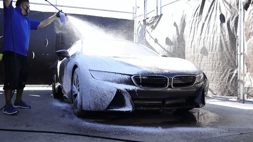 man washing BMW